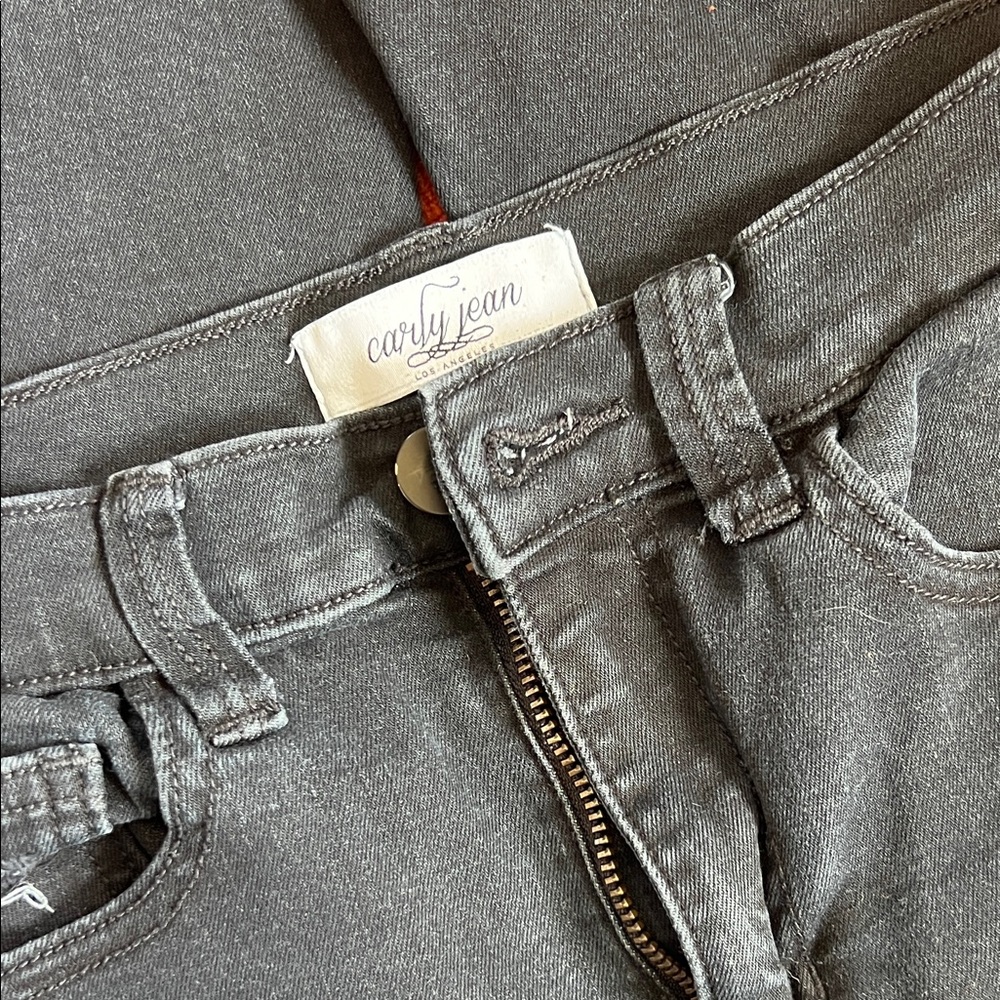 Carly Jean Los Angeles Black Jeans with Partially-Distressed bottom hem & Knees